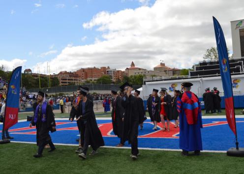 Graduates walking on the field