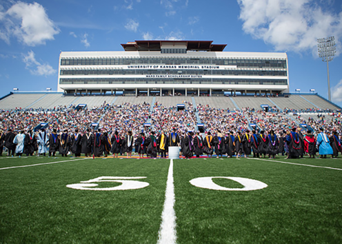 Graduates on the football stadium